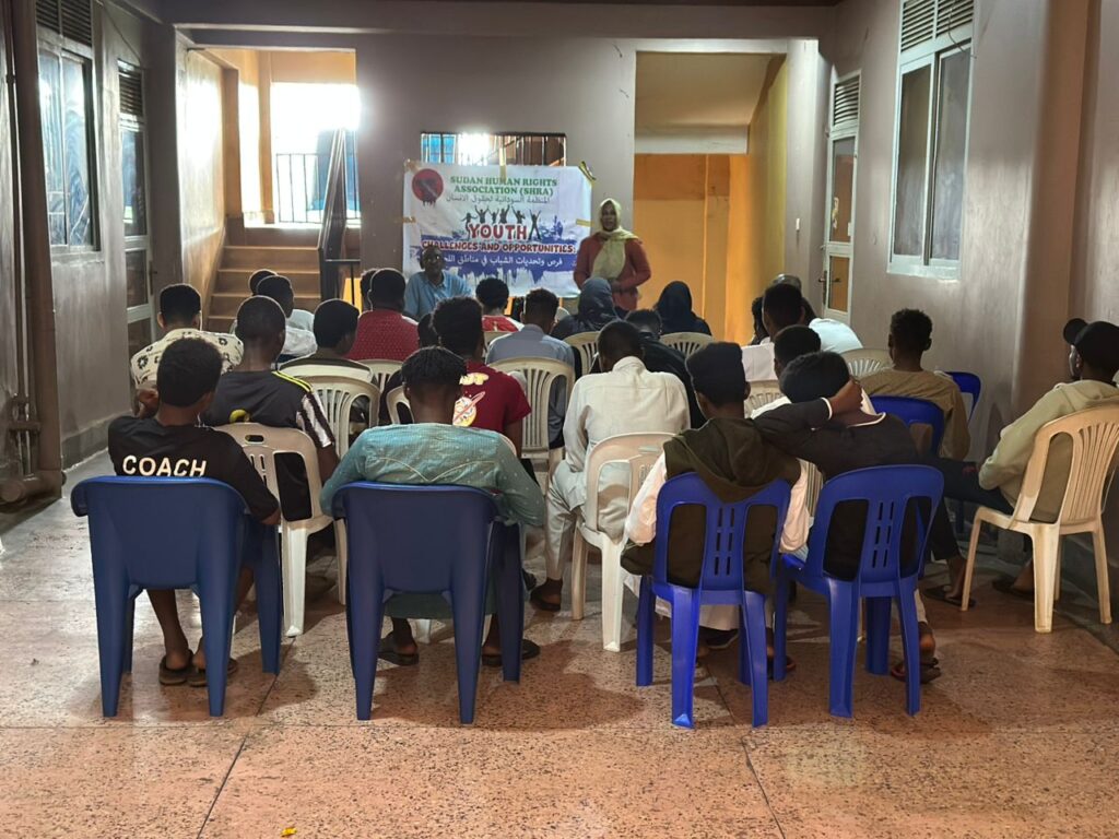 SHRA team educating refugee youth on rights and protection during a Kampala discussion event