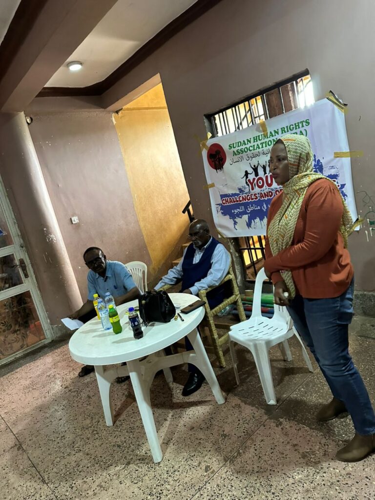 SHRA facilitators in active discussion with youth participants